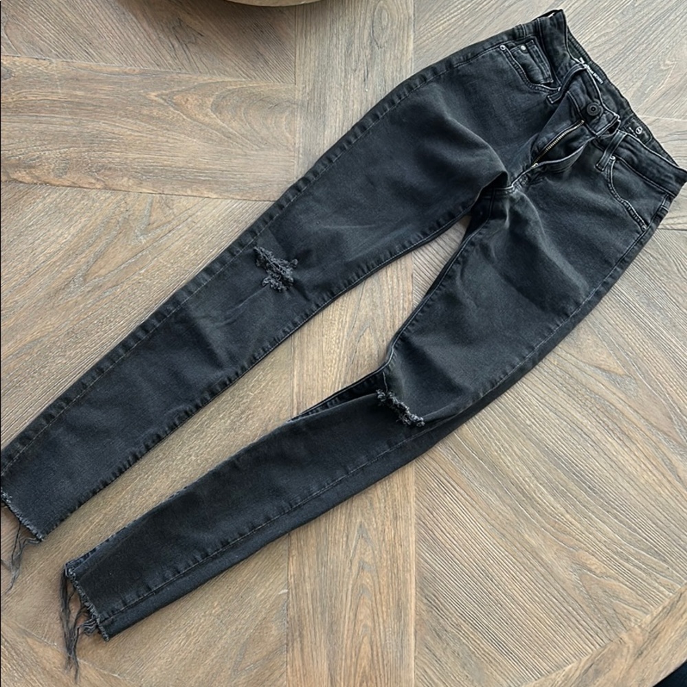 AG Skinny black distressed jean size 24r